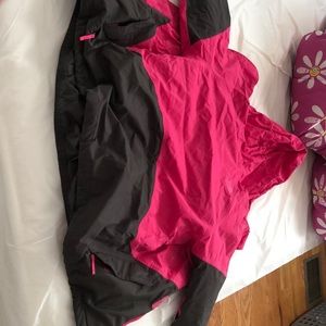 A pink north face coat